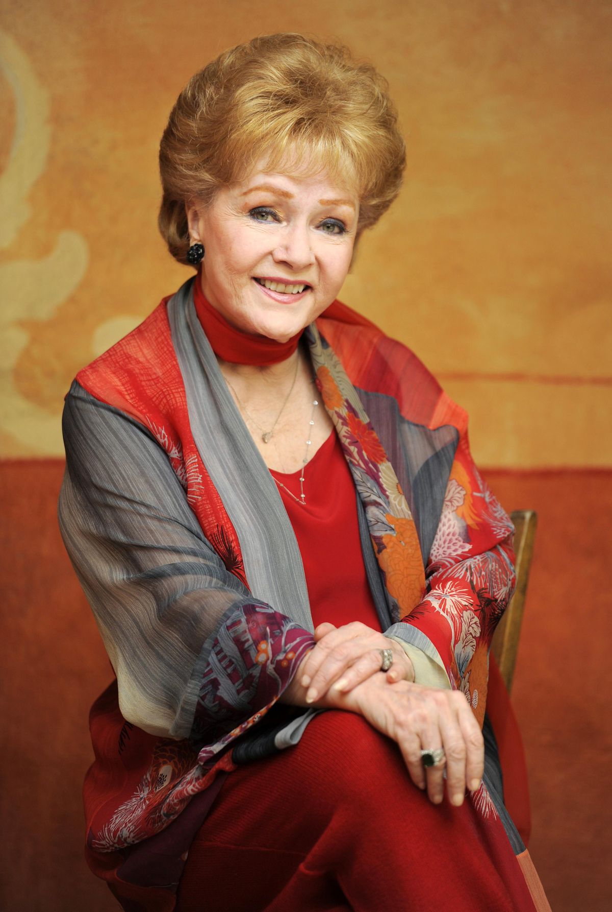 FILE - In this May 21, 2013 file photo, actress Debbie Reynolds poses for a portrait in Beverly Hills, Calif. Reynolds, star of the 1952 classic "Singin