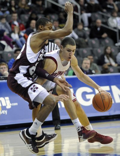 Associated Press WSU’s Klay Thompson, right, is a force on both ends of the court. (Associated Press / The Spokesman-Review)