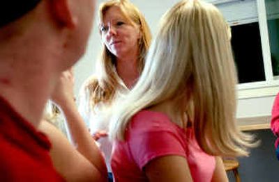 
Teachers' assistant Lisa Lewis, center, talks with Bridge Academy students during lunch break at the school in Coeur d'Alene.Teachers' assistant Lisa Lewis, center, talks with Bridge Academy students during lunch break at the school in Coeur d'Alene.
 (Kathy Plonka/Kathy Plonka/ / The Spokesman-Review)