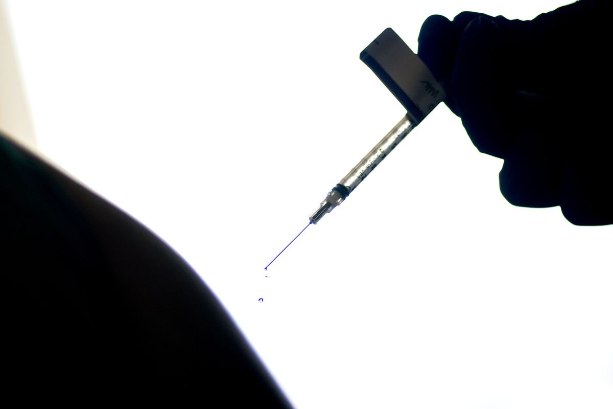 FILE - In this Dec. 15, 2020, file photo, a droplet falls from a syringe after a health care worker was injected with the Pfizer COVID-19 vaccine at a hospital in Providence, R.I. An untold number of Americans have managed to get COVID-19 booster shots even though the U.S. government hasn