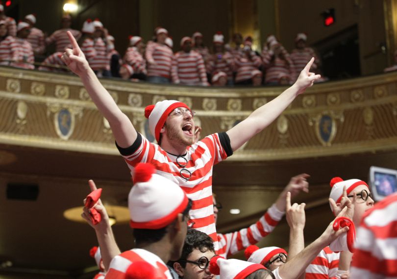 ORG XMIT: NJBRU102 Students, faculty, and staff at Rutgers University try to break a Guinness World Records for the greatest number of people dressed as Waldo of Where's Waldo at the State Theatre in New Brunswick on Thursday, April 2, 2009. Some 1,052 people in red and white shirts and caps turned out on the Rutgers University campus Thursday in a bid to stage the largest gathering of people dressed as Where's Waldo. (AP Photo/Home News Tribune, Augusto F. Menezes) ** THE STAR-LEDGER OUT ** (Augusto Menezes / The Spokesman-Review)