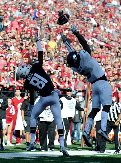 Washington State Cougars wide receiver Renard Bell (81) and Nevada Wolf Pack defensive back Dameon Baber (5) battle for a ball during the first half of an NCAA college football game on Saturday, Sept. 23, 2017, at Martin Stadium in Pullman. (Tyler Tjomsland / The Spokesman-Review)