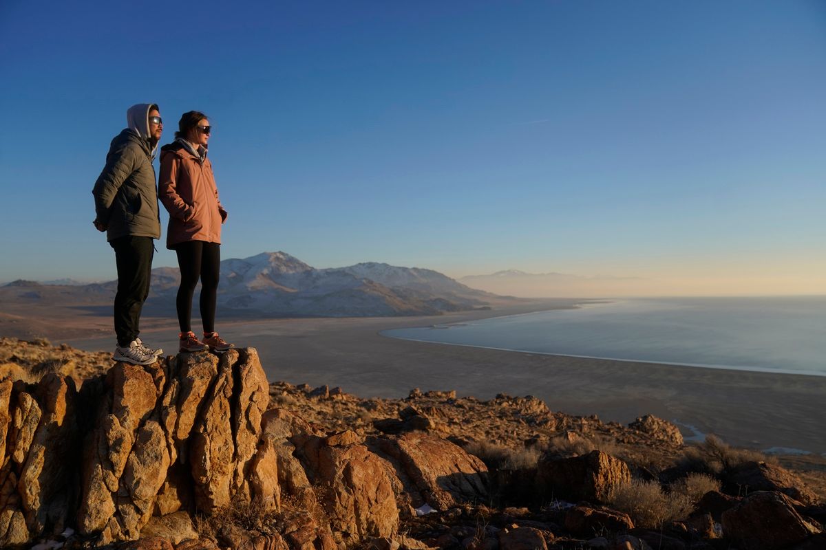 Antelope Island State Park visitors view the receding edge of the Great Salt Lake on Jan. 28 at Antelope Island, Utah. (Rick Bowmer)