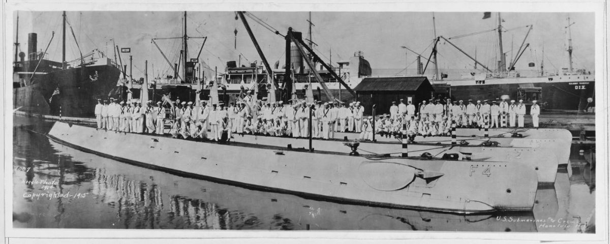A 1914 photo shows the U.S. submarine F-1, nearest the dock, which sank after a collision with submarine F-3, moored right beside it in 1917.  (Roy L. Noggle/U.S. Naval History and Heritage Command)