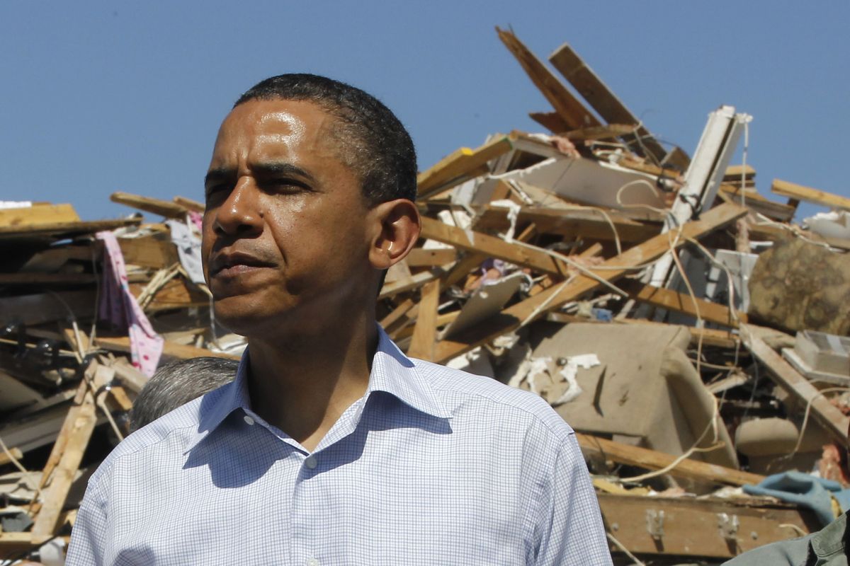 President Barack Obama visits tornado damage in the Alberta neighborhood in Tuscaloosa, Ala., Friday, April 29, 2011. (AP Photo)