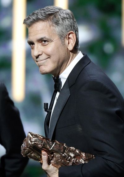 Actor George Clooney reacts on stage as he received an Honorary Cesar award during the 42nd Cesar Film Awards ceremony at Salle Pleyel in Paris, Friday, Feb. 24, 2017. This annual ceremony is presented by the French Academy of Cinema Arts and Techniques. (Thibault Camus / AP)
