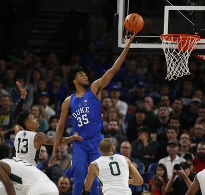 Duke's Marvin Bagley III (35) gets past Portland State's Jamie Orme (13) to score during the first half of an NCAA basketball game at the Phil Knight Invitational tournament in Portland, Ore., Thursday, Nov. 23, 2017. (Timothy J. Gonzelez / Associated Press)