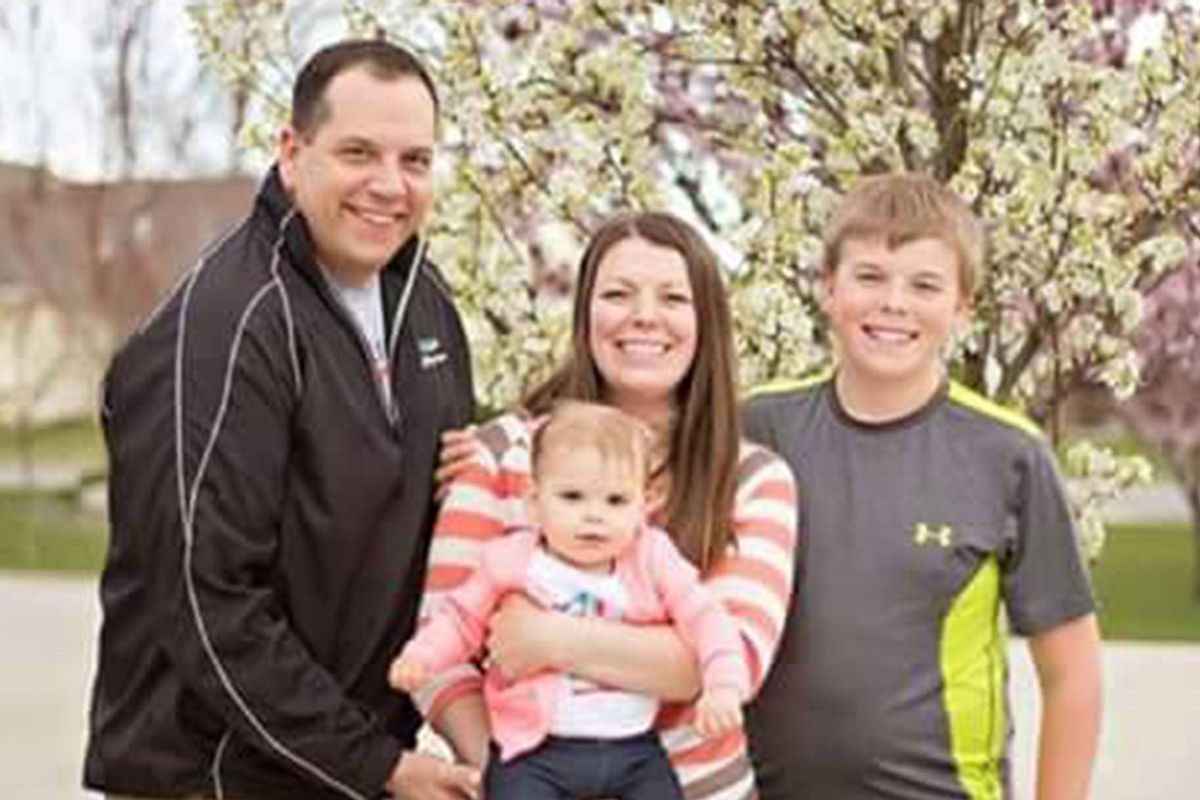 Greg Moore poses for a recent family photo with his wife, Lindy, their daughter, Gemma, and his son, Dylon.