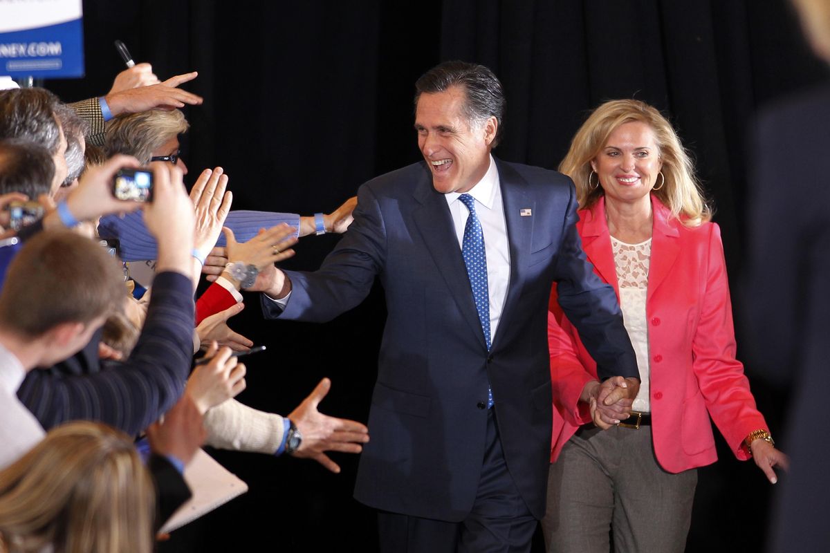 Mitt Romney and his wife, Ann, greet supporters as they arrive at their Super Tuesday primary rally in Boston on Tuesday. (Associated Press)