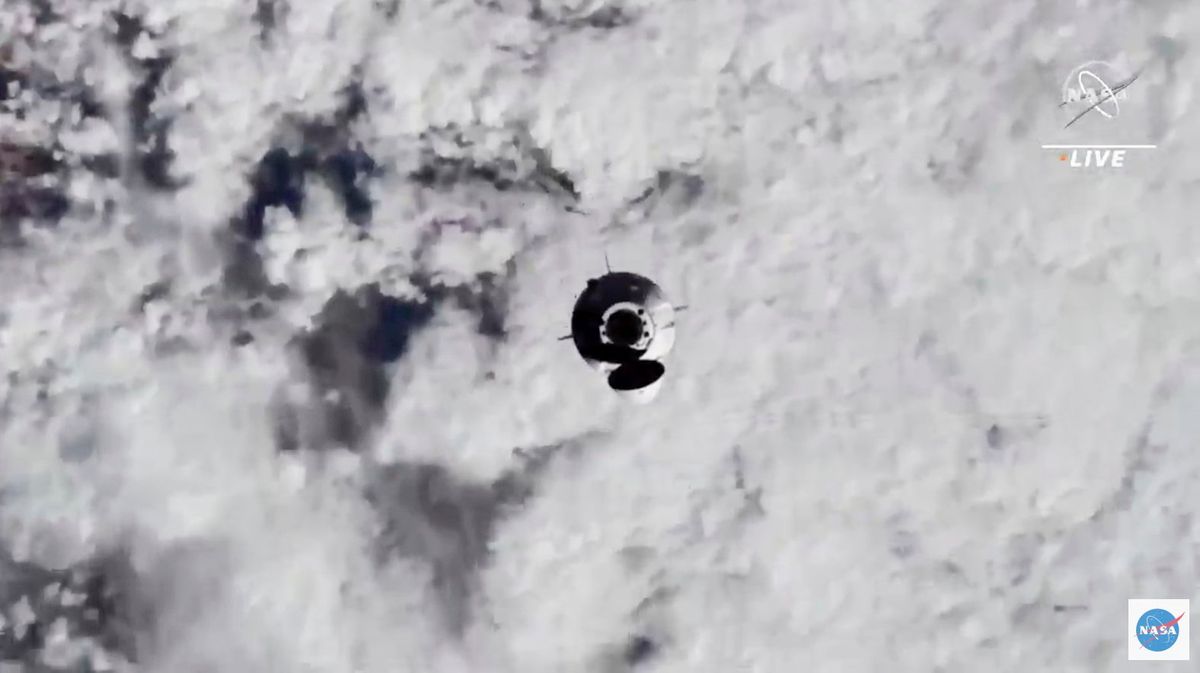 In this image from video made available by NASA, astronauts in the SpaceX Dragon capsule approach the International Space Station on Thursday, Nov. 11, 2021.  (HOGP)