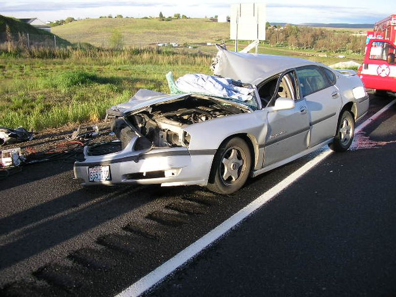 A Newport, Wash., man is accused of causing a car crash on Interstate 84 in Oregon early Wednesday that left his passenger in critical condition and led police to three pounds of marijuana.
Joshua Samuel McDonald, 25, was arrested after his 2000 Chevrolet Impala slammed into the left rear corner of a semi-trailer and continued under the rear of the rig, ripping the car's roof. (Oregon State Police)