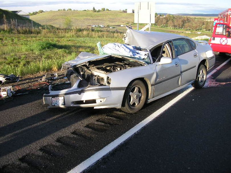 A Newport, Wash., man is accused of causing a car crash on Interstate 84 in Oregon early Wednesday that left his passenger in critical condition and led police to three pounds of marijuana.
Joshua Samuel McDonald, 25, was arrested after his 2000 Chevrolet Impala slammed into the left rear corner of a semi-trailer and continued under the rear of the rig, ripping the car's roof. (Oregon State Police)