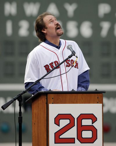 Former Red Sox legend Wade Boggs looks skyward at his jersey retirement ceremony. (Elise Amendola / Associated Press)