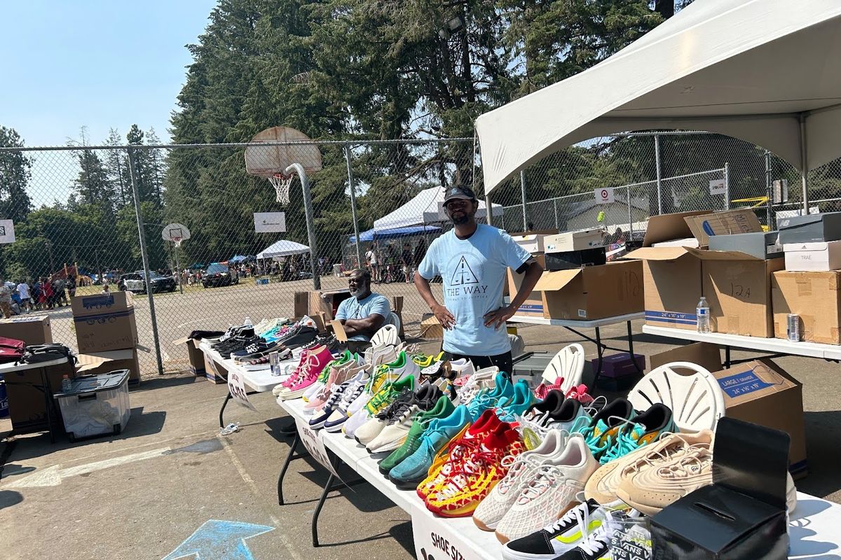 Volunteers give away shoes at Underhill Park.  (Courtesy)