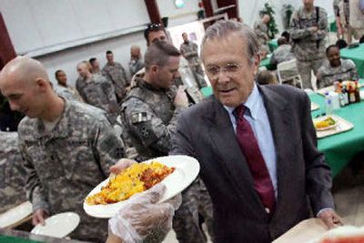 
Secretary of Defense Donald Rumsfeld has lunch with U.S. troops at Forward Operating Base Prosperity in Baghdad. 
 (Associated Press / The Spokesman-Review)