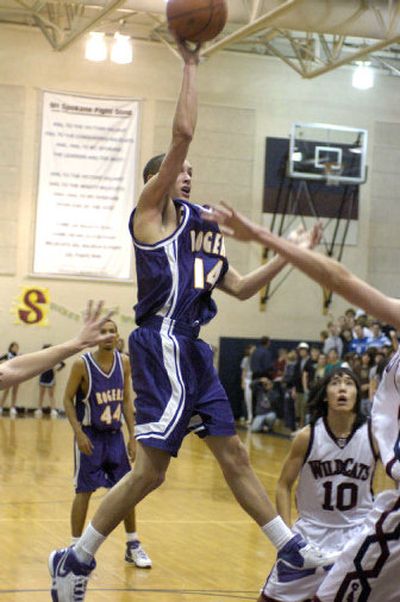 
Mikol Mabry of Rogers elevates for a shot against Mt. Spokane in a game the Wildcats won 40-36.  
 (Dan Pelle / The Spokesman-Review)
