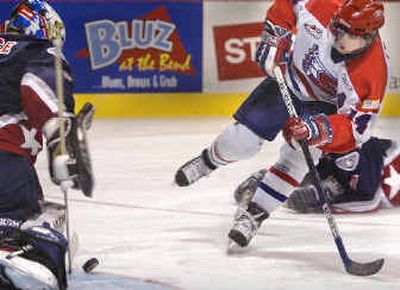 
Spokane Chiefs veteran Jeff Lynch watches his shot head toward Tri-City Americans goalie Carey Price during a game at the Spokane Arena earlier this season. 
 (Christopher Anderson/ / The Spokesman-Review)