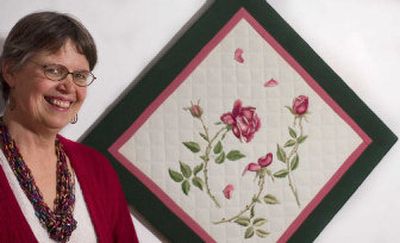 
Suzi Hokonson takes pieces of fabric, like this silk-threaded embroidery, and frames them to be displayed as art.
 (Kathryn Stevens / The Spokesman-Review)