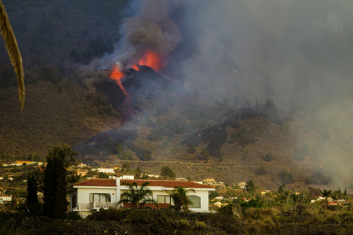 Lava flows from an eruption of a volcano at the island of La Palma in the Canaries, Spain, Sunday, Sept. 19, 2021. A volcano on Spain