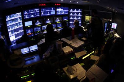 
Producers in a broadcast truck parked outside the Metropolitan Opera, conduct a live switch, editing during a rehearsal taping of Verdi's 