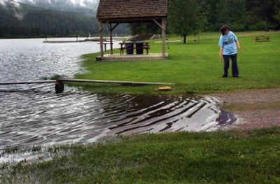 Helen Wilkerson, an employee of The Outpost Resort near Cusick, Wash., stands near the Pend Oreille River on Friday at the resort's campground.
(Jed Conklin / The Spokesman-Review)