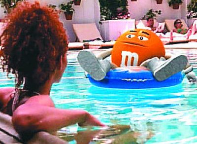 
Can you come up with something as sweet as actress Halle Berry sharing a swimming pool with the M&M's crispy chocolate candy in this scene from the M&M Mars 1999 Super Bowl commercial?
 (Associated Press / The Spokesman-Review)