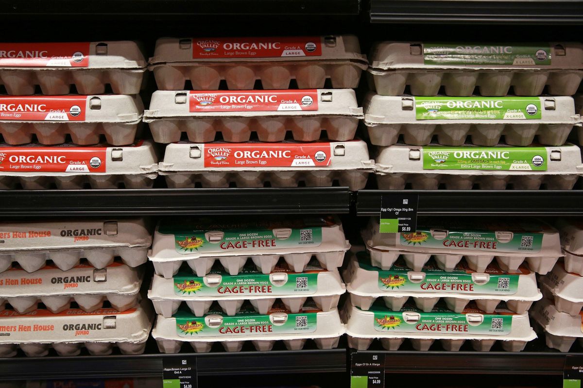 Organic and cage-free eggs sit on display shelves during an opening celebration event at Mrs. Green’s Natural Market, Nov. 14, 2013, in Chicago. (John J. Kim / Tribune News Service)