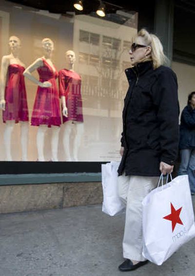 
A shopper walks past Macy's in New York on Monday. Macy's says its profit edged up 2.3 percent in the fourth quarter as a tax settlement helped offset weaker-than-expected sales. Associated Press
 (Associated Press / The Spokesman-Review)