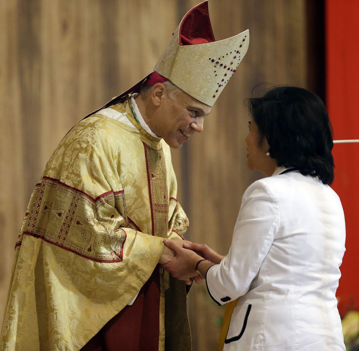 Salvatore J. Cordileone greets a congregation member during a ceremony to install him as the new archbishop of San Francisco at the Cathedral of St. Mary of the Assumption in San Francisco,  Thursday,  Oct. 4, 2012. (Marcio Sanchez / Pool)