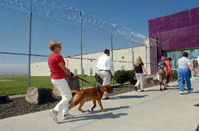 
Dogs and handlers make their way into the Idaho Correctional Center. Eight dogs from the Idaho Humane Society are involved in the Inmate Dog Alliance Project. 
 (Associated Press / The Spokesman-Review)