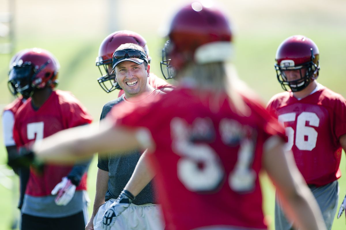 Serious but light, Eastern football coach Beau Baldwin found something to laugh about Wednesday as the Eagles opened fall camp. (Tyler Tjomsland)