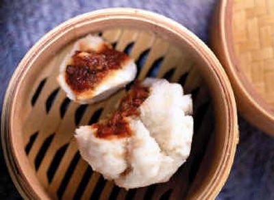 
A traditional Chinese dim sum meal includes many small dishes, such as steamed buns with barbecued pork. 
 (The Spokesman-Review)