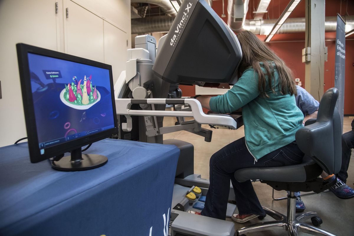 Jacqui McPeck, a senior at Spokane Valley High School, completes the da Vinci Xi robotic surgery machine training program, Nov. 4, 2016, at the WSU South Campus Facility. She scored a 39 on the test. (Dan Pelle / The Spokesman-Review)