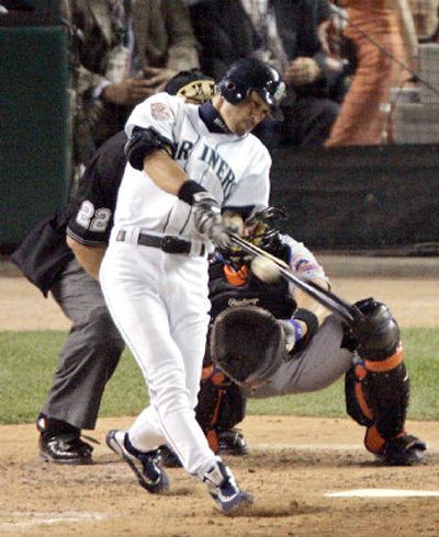
Seattle's Ichiro Suzuki connects on a two-run single in the fourth inning off Washington's Livan Hernandez, giving the American League a 5-0 lead. 
 (Associated Press / The Spokesman-Review)