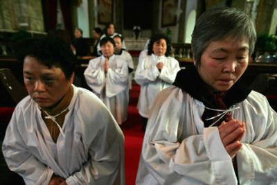 
Catholics pray at the officially sanctioned Nantang Cathedral in Beijing earlier this month.
 (Associated Press / The Spokesman-Review)