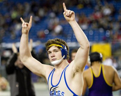 Deer Park's Trevor Eicher salutes the crowd after capping off the Stags’ state championship. (Patrick Hagerty / Patrick Hagerty Special to The Spokesman-Review)