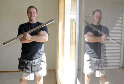 Shane Rotchford operates Prestige Home Window Tinting in Hayden. Tinting is a way of saving money on home cooling because homes heat up less with the tinting installed. The Spokesman-Reviewi
 (JESSE TINSLEY i / The Spokesman-Review)