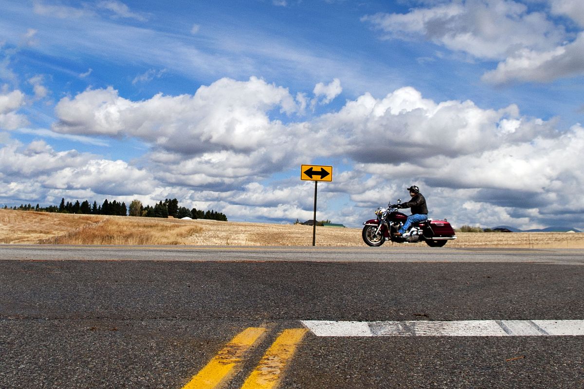 A motorcyclist drives past Old Argonne Road on Bigelow Gulch Road on Monday. (Kathy Plonka)