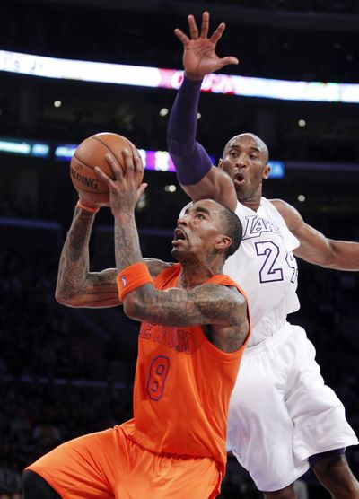 New York guard J.R. Smith (8) was held to five points in the fourth by a stout Lakers defense. (Associated Press)