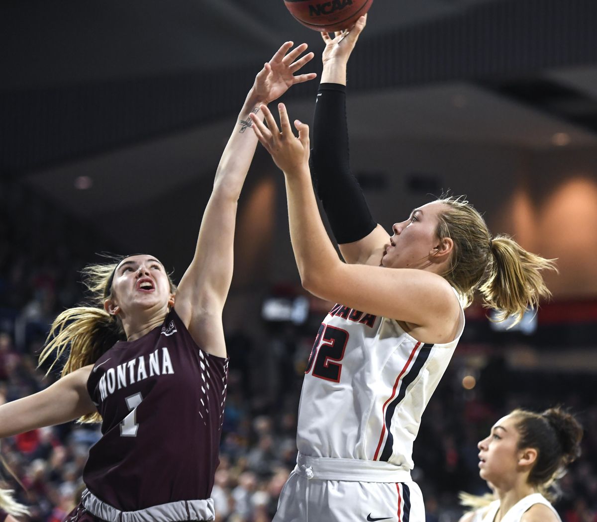 Gonzaga guard Jill Townsend (32) fires over Montana guard Katie Mayhue (1), Wednesday, Nov. 7, 2018, in the McCarthey Athletic Center. (Dan Pelle / The Spokesman-Review)