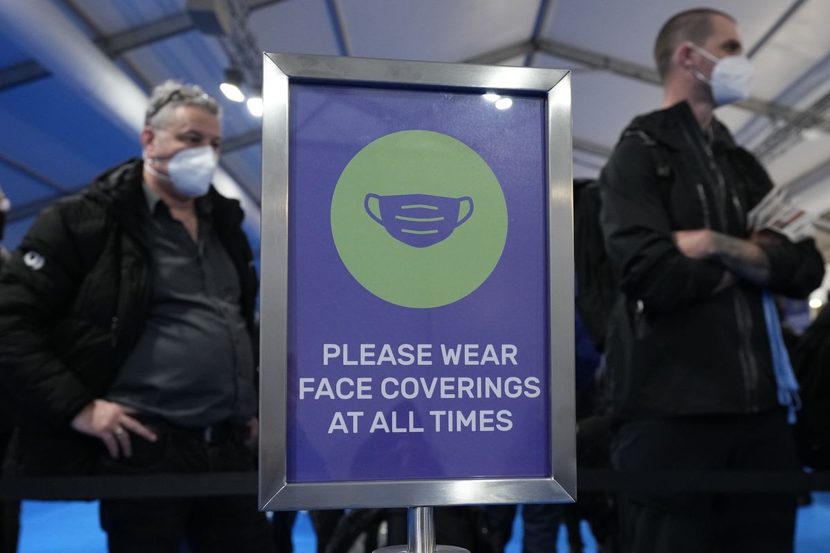 In this Oct. 29, 2021 photo, attendees wait for registration to enter the venue where the U.N. climate conference will be held in Glasgow, Scotland. Despite the concerns about the coronavirus from some of the delegates from around the world, the British government decided to hold an in-person conference, arguing that world leaders must act now to prevent catastrophic global warming — and that they will be more effective if they can talk face-to-face.  (Matt Dunham)