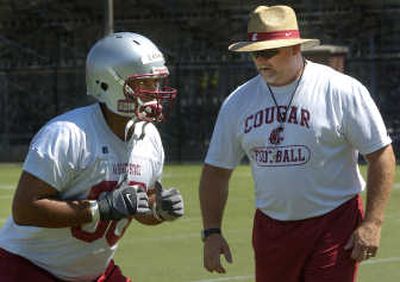 Washington State offensive line coach George Yarno eyes Reed Lesuma, who is competing for starting spot.
(Dan Pelle / The Spokesman-Review)