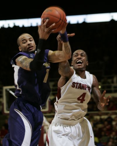 UW guard Venoy Overton, left, steals the ball from Stanford guard Anthony Goods.  (Associated Press / The Spokesman-Review)