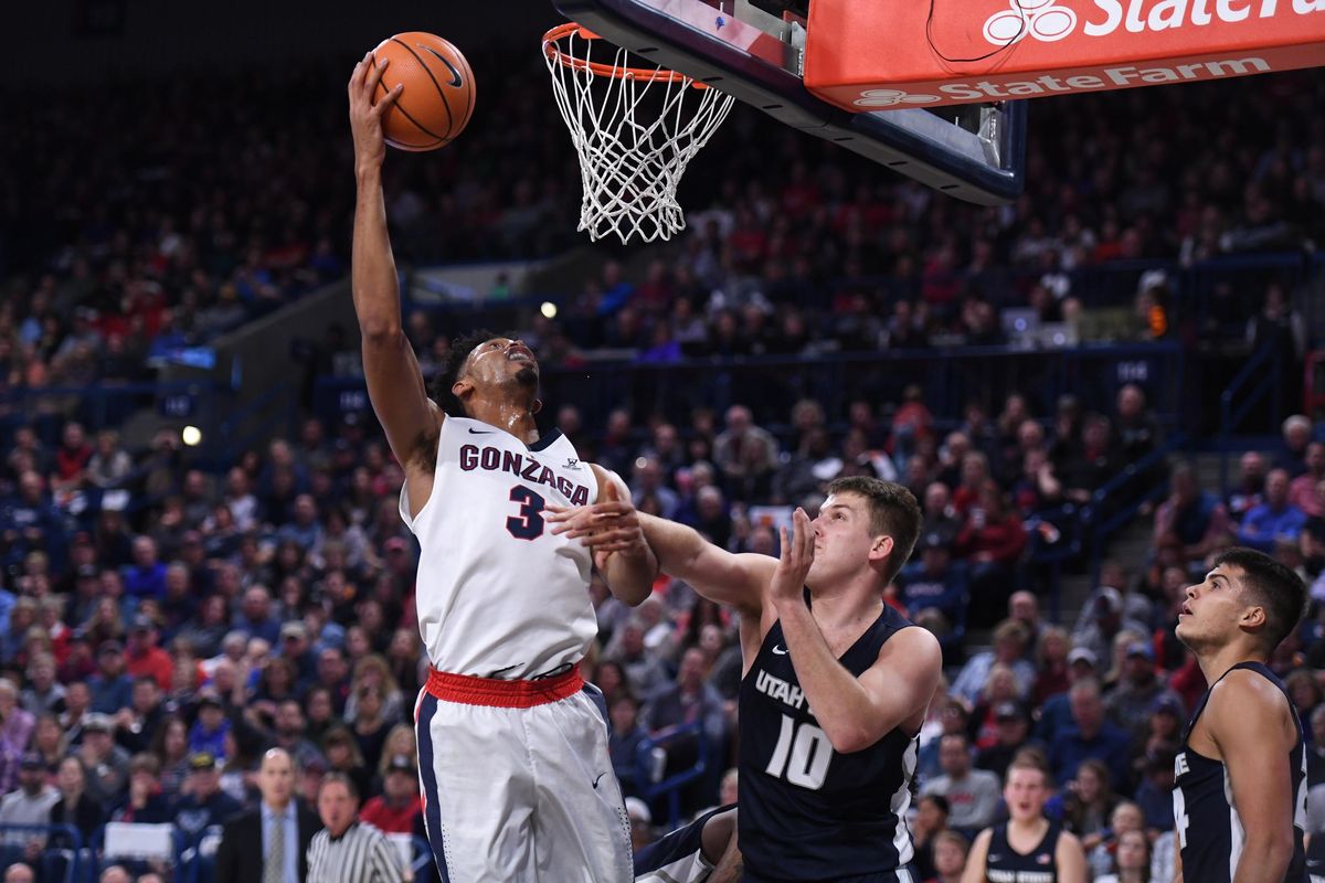 Gonzaga forward Johnathan Williams (3) goes for a layup as Utah State forward Quinn Taylor (10) defends during the first half of an NCAA college basketball game, Sat. Nov. 18, 2017 in the McCarthey Athletic Center. (Colin Mulvany / The Spokesman-Review)