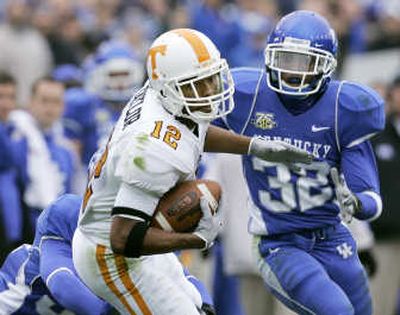 
Tennessee receiver Lucas Taylor  looks for more yardage against Kentucky defenders. Associated Press
 (Associated Press / The Spokesman-Review)