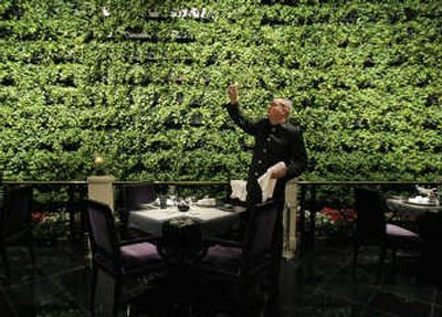 
Chef de rang Yann Bousseau sets a table at Joel Robuchon, a Michelin three-star restaurant, at the MGM Grand. Associated Press photos
 (Associated Press photos / The Spokesman-Review)