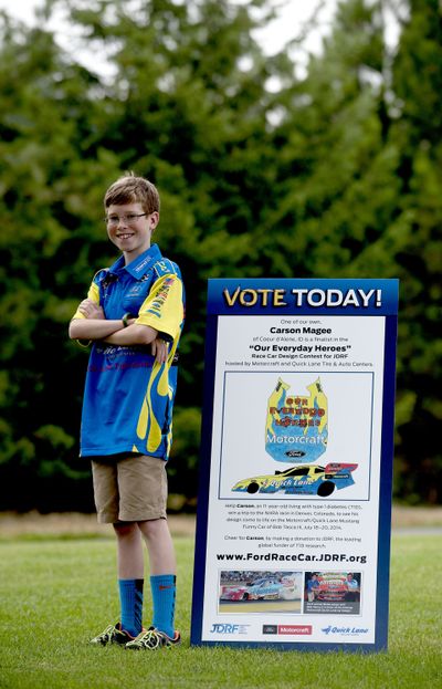 Carson Magee, 11, stands in Coeur d’Alene’s Riverstone Park next to his winning race car design for the “Our Everyday Heroes” contest. His design pays homage to firefighters, emergency medical technicians, police and the U.S. armed services. (Kathy Plonka)