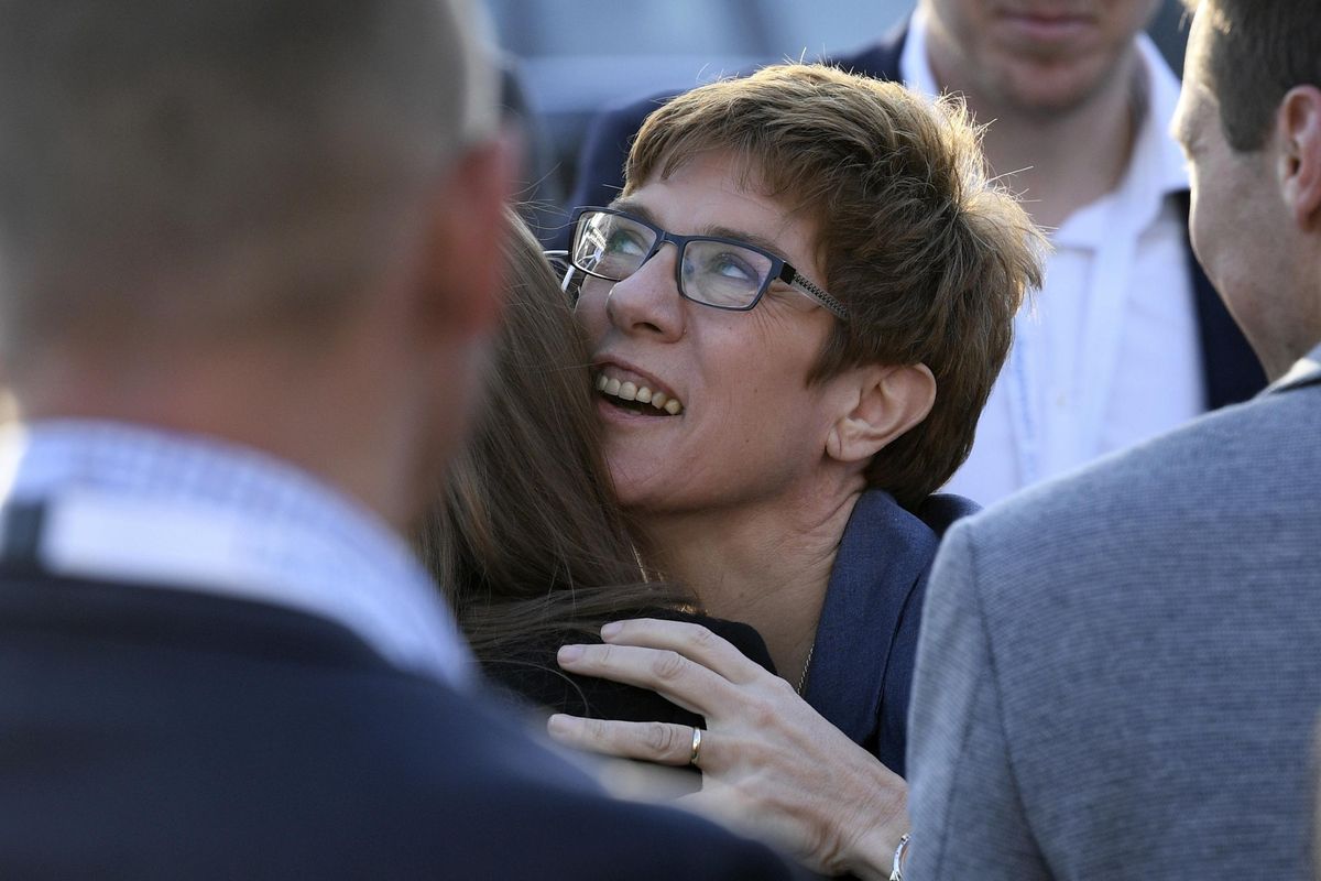 Saarland governor Annegret Kramp-Karrenbauer of the Christian Democratic party is congratulated after the election in the German state of Saarland in Saarbruecken, Sunday, March 26, 2017. Chancellor Angela Merkel