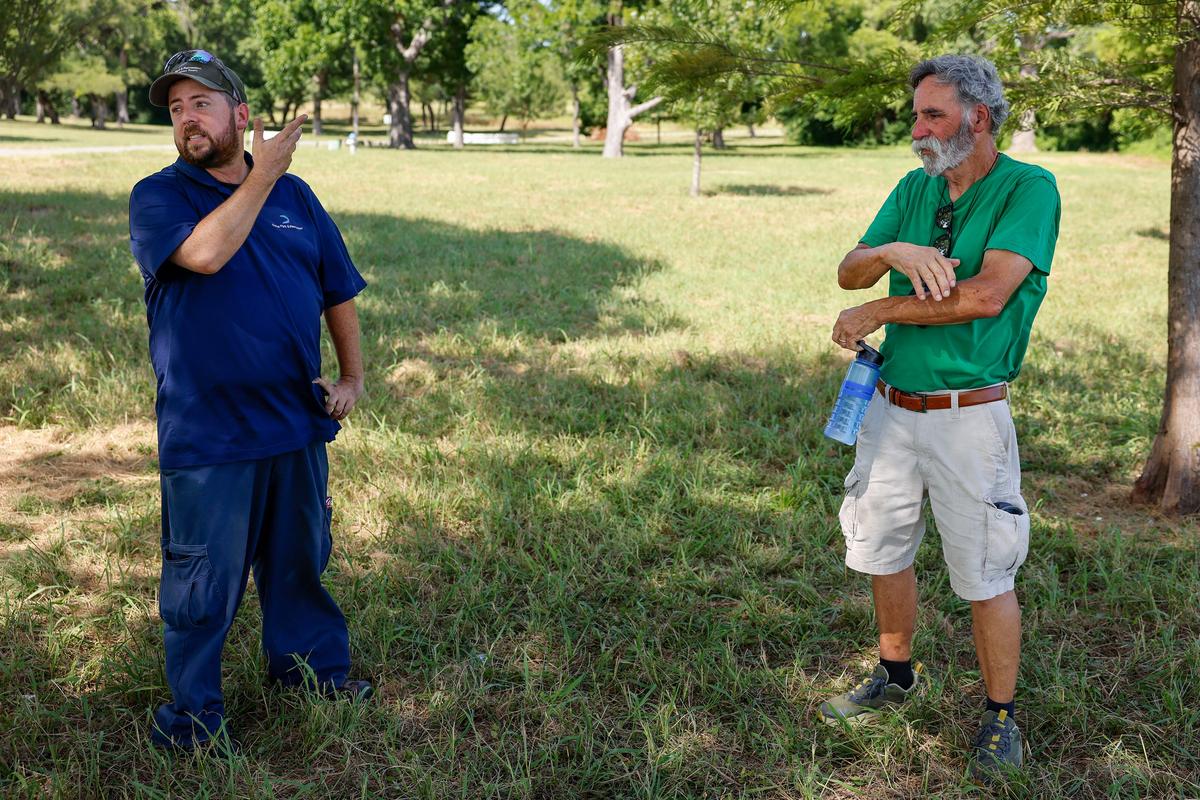 Chris Morris, Dallas Park and Recreationâ€™s urban biologist, talks with Dallas resident Dick Morrison while watching bald eagles and their eaglets at White Rock Lake on Thursday, July 9, 2026, in Dallas, Texas. (ElÃas Valverde II/Dallas Morning News/TNS) 