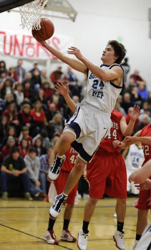 Gonzaga Prep’s Chris Sarbaugh glides in for a first-half layup against Ferris. (Colin Mulvany)